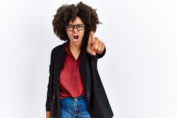 Fototapeta na wymiar African american woman with afro hair wearing business jacket and glasses pointing displeased and frustrated to the camera, angry and furious with you
