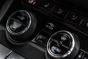 Digital control panel car air conditioner dashboard. Modern car interior conditioning buttons inside a car close up view.