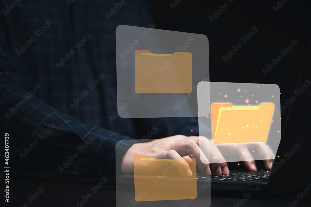 Poster Businessman using computer laptop with virtual folder graphic for online document database management concept.