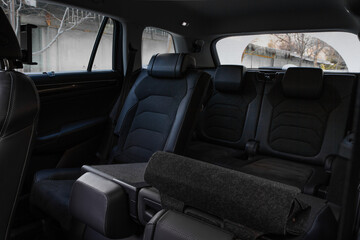 Folding seats and a cargo space inside suv car. Modern car interior. Huge, clean and empty car...