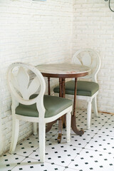 vintage table and chair with white wall
