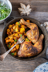 Chicken with pumpkin and salad in a skillet