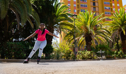 African American teenager skating towards the camera