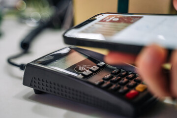 Payment for goods through a bank terminal in a contactless way using a smartphone (apple pay)....