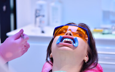 Patient with dental retractor in mouth