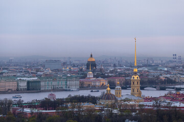 Aerial dusk landscape of St Peterburg. Peter and Paul Cathedral, Saint Isaacs Cathedral, Winter Palace, Admiralty building. Cityscape with the dominants of Saint Petersburg. Travel destination.