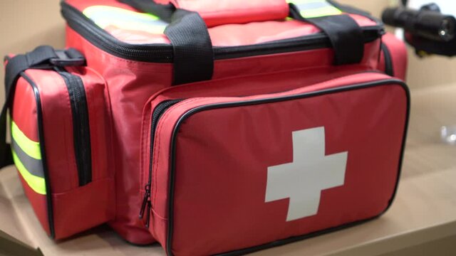 Red first aid equipment bag emergency for accident disaster 