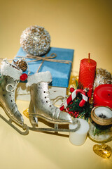 New year atmosphere New Year's gift, candle and Christmas toys, garland on yellow background. X-mas things