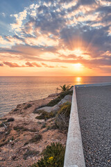 Beautiful sunset with a dramatic sky and clouds over the sea
