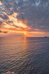 Beautiful sunset with a dramatic sky and clouds over the sea
