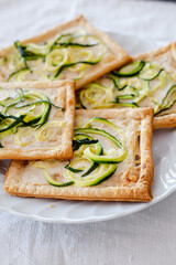Pizza with zucchini and vegetable cheese. Vegan appetizer