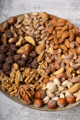 top view of assorted different types of nuts on a plate