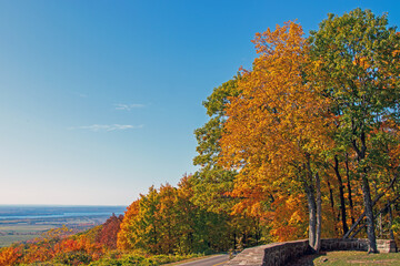 Fototapeta premium Fall foliage and a blue sky from a lookout in autumn. Gatineau Park, Quebec, Canada