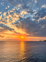 Beautiful sunset with a dramatic sky and clouds over the sea