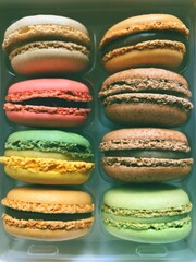 Colourful macaroons in bakery packaging