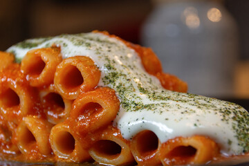 Italian Pasta with tomato and stringy cream cheese