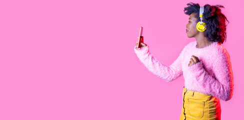 Young black woman holding smartphone videocalling communicating during post pandemic new normal period isolated background