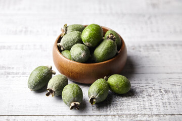 Feijoa fruits or pineapple guava in bowl on wooden table