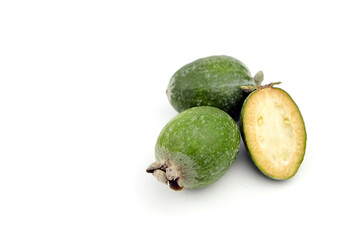 Feijoa fruit or whole and half pineapple guava isolated on white