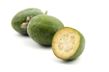 Feijoa fruit or whole and half pineapple guava isolated on white