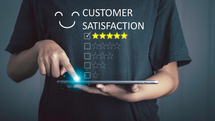 Customer Experience happy concept. Businessman touch on select five stars with smiley face for the best excellent evaluation of satisfaction; service like; Good quality; High rating; social very good.