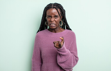 black pretty woman looking angry, annoyed and frustrated screaming wtf or what’s wrong with you
