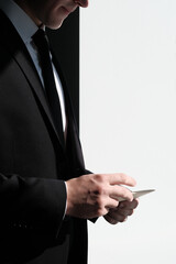 businessman holds an envelope and opens it