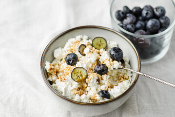 cottage cheese with blueberries on table