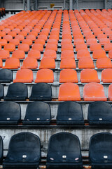 Empty stands and seats for fans and fans in the open-air stadium. Lack of fans during the pandemic.