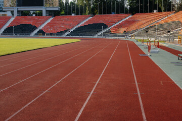 Running tracks close-up at the stadium during sunset. Sports facilities for running. Sport.