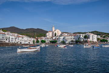 View of Cadaques with the church bell and white houses from a boat, Catalonia, Spain