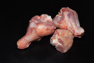 Turkey drumsticks with skin. Organic turkey meat with greens