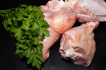 Turkey drumsticks with skin. Organic turkey meat with greens