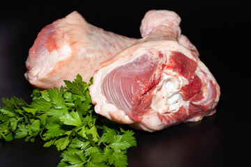 Turkey drumsticks with skin. Organic turkey meat with greens