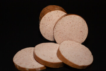 Boiled turkey sausage cut into slices in food packaging. Meat products of poultry