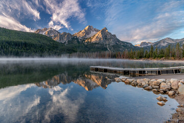 Beautiful Idaho mountain lake reflection and dock