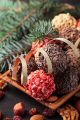 Homemade chocolate candy with nuts and dried fruits.