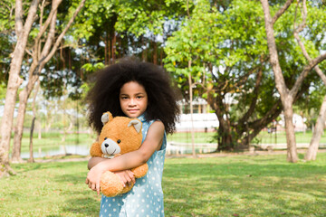Portrait of child girl playing in the park with happy and smile