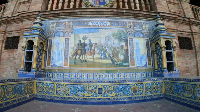 Seville, Spain, September 11, 2021: The Spanish Steps in Seville or Plaza de Espana. The 52 frescos depict all 52 Spanish provinces. The tiles are typical of Andalusia, the so-called azulejos.