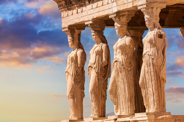 Detail of Caryatid Porch on the Acropolis uring colorful sunset in Athens, Greece. Ancient Erechtheion or Erechtheum temple. World famous landmark at the Acropolis Hill. - obrazy, fototapety, plakaty