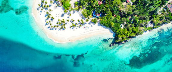 Vacation background. Aerial drone view of beautiful caribbean tropical island Cayo Levantado beach with palms. Bacardi Island, Dominican Republic. - obrazy, fototapety, plakaty