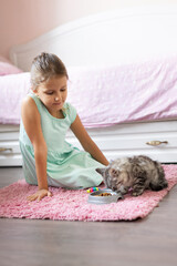 girl with little kitten