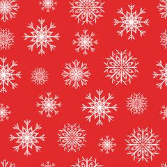 White snowflakes seamless pattern on red background.