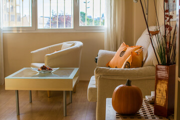Cozy Living Room Interior Inspired By Autumn Colors. Pumpkin Inside The House On Halloween