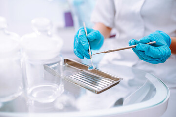 A set of sterile dental instruments for dental treatment. Dental care for people.