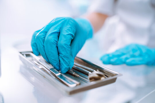 A set of sterile dental instruments for dental treatment. Dental care for people.