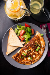 Delicious Egg Omelette with Cheese top view, flat lay