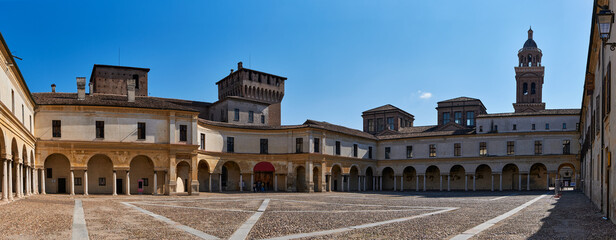Panoramic view of a medieval square and entrance to the palace