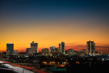 Fototapeta na wymiar downtown city skyline at dusk / Golden Hour