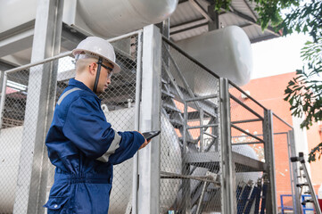 Engineers work place to keep liquid helium,preventive maintenance schedule checking,Thailand people